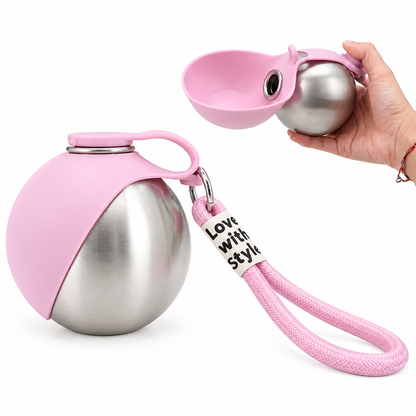 Restyled product shot of the pink dog water bottle with hand and strap