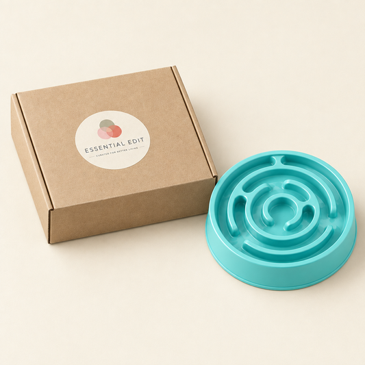 Slow-feeder bowl beside a kraft box with a round Essential Edit sticker